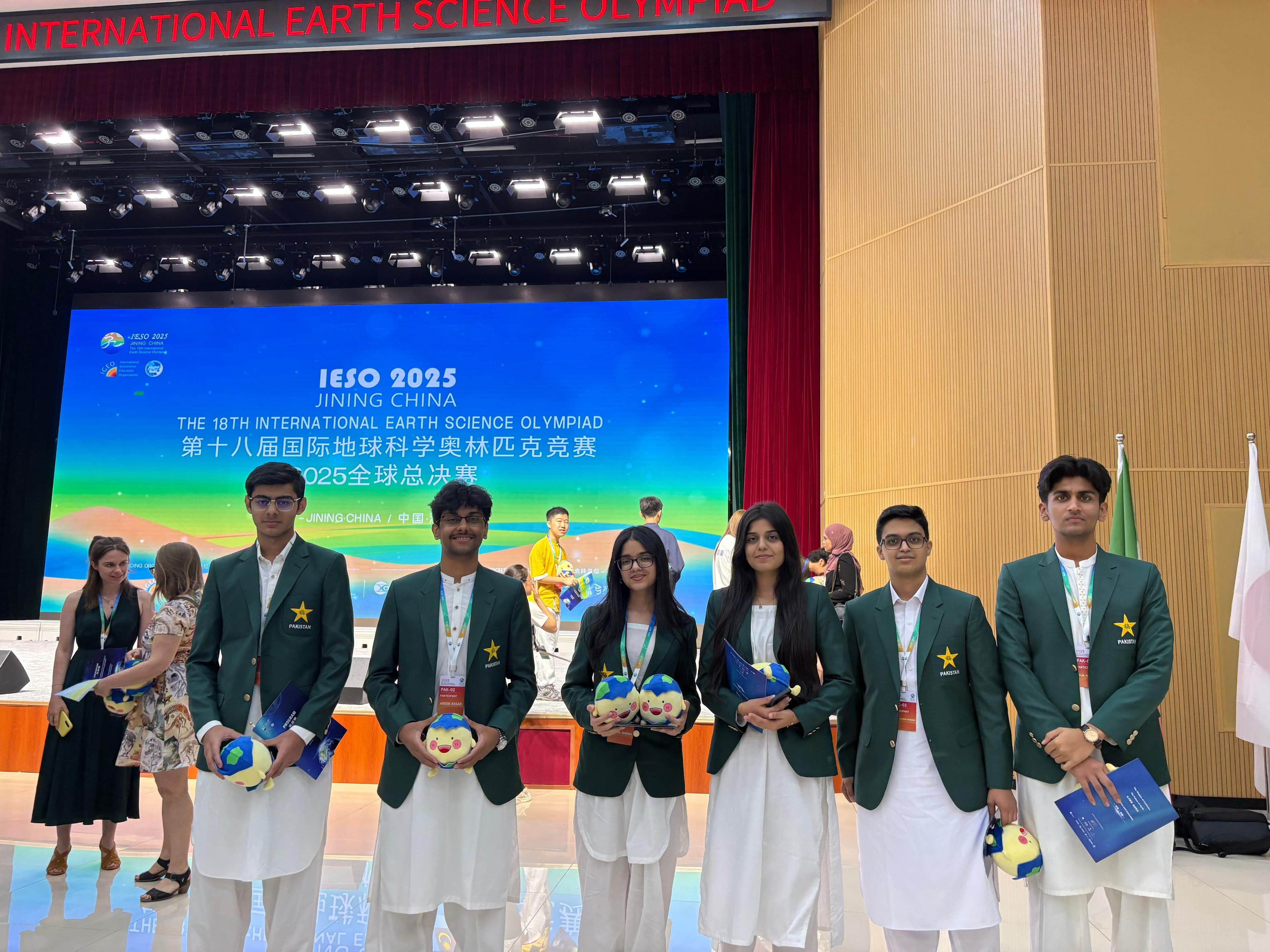 AOC students representing Pakistan on stage at the 18th International Earth Science Olympiad in Jining, China.