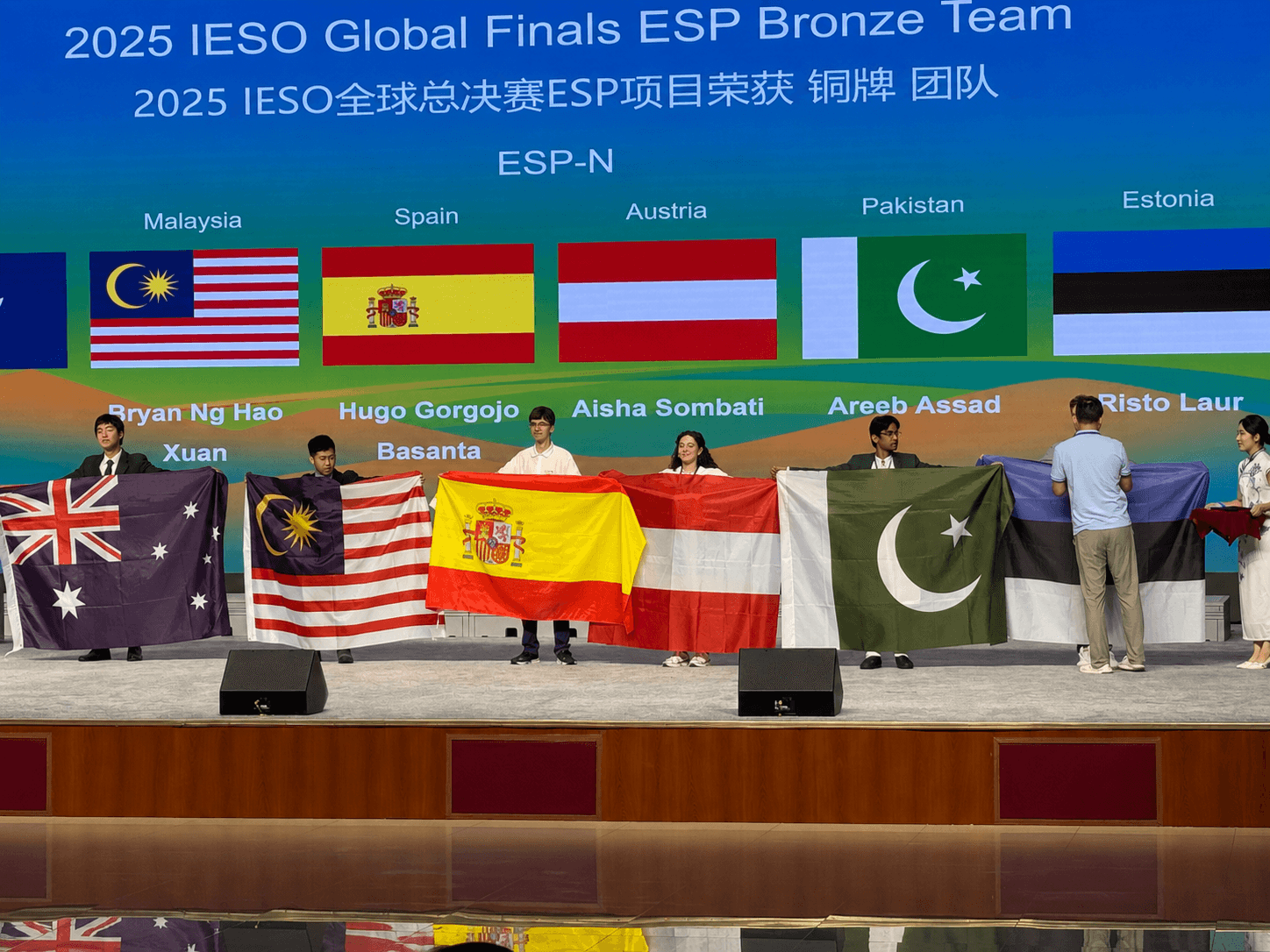 Award ceremony slide announcing the IESO 2025 Earth Science Project Bronze team, which included a student from Pakistan.